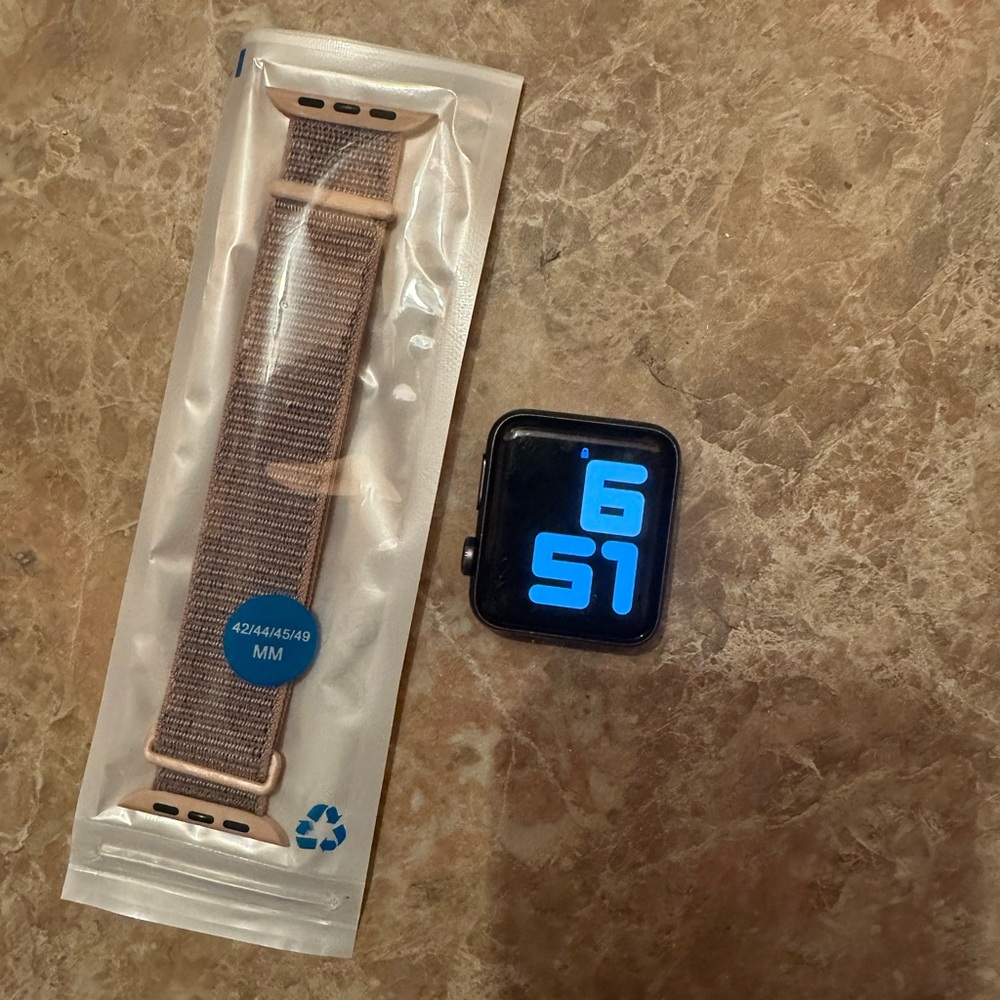 Apple Watch Series 3 (cellular model) with Beige Strap. Charger included